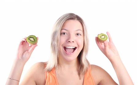 simsearch:400-03908812,k - Beautiful young smiling girl with kiwi fruit, isolated on white background Fotografie stock - Microstock e Abbonamento, Codice: 400-03966796