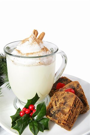 palos verdes - Slices of delicious Christmas cake on a plate with a mug of creamy eggnog.  White background. Foto de stock - Super Valor sin royalties y Suscripción, Código: 400-03966822
