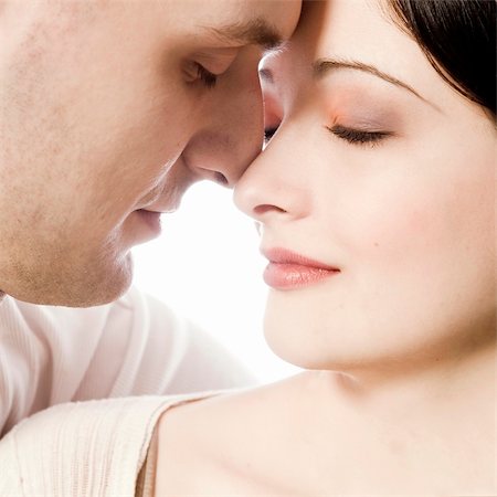 simsearch:400-04482792,k - Studio portrait of pretty young couple in love Stock Photo - Budget Royalty-Free & Subscription, Code: 400-03966835