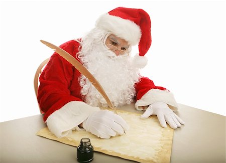 simsearch:400-06772771,k - Santa sitting at his desk using a quill pen to make his naughty and nice list on parchment.  White background. Photographie de stock - Aubaine LD & Abonnement, Code: 400-03966861