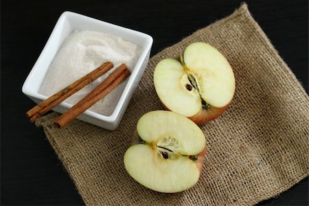 preparation of apple pie - apples, sugar, cinnamon, ingredients for making apple pie Stock Photo - Budget Royalty-Free & Subscription, Code: 400-03966934