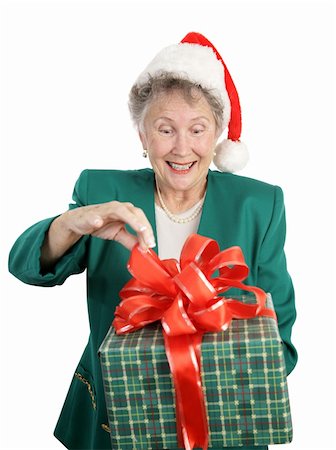 simsearch:400-03967470,k - A senior woman anticipating opening a big Christmas gift.  Isolated on white. Fotografie stock - Microstock e Abbonamento, Codice: 400-03966966