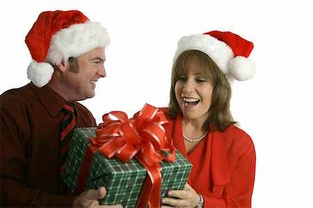 simsearch:400-03967457,k - A man giving a woman a Christmas gift.  Isolated on white. Foto de stock - Royalty-Free Super Valor e Assinatura, Número: 400-03966979