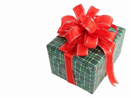 simsearch:400-03961239,k - A green wrapped Christmas gift with a red bow, isolated with room for text. Photographie de stock - Aubaine LD & Abonnement, Code: 400-03967051