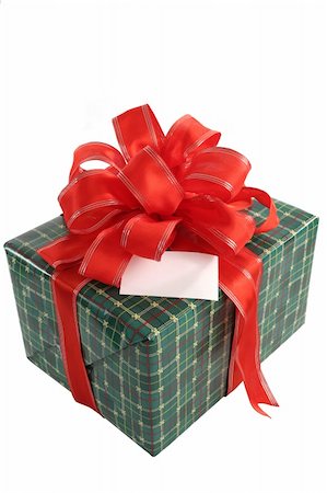 simsearch:400-03961239,k - A green wrapped Christmas gift with a red bow and a blank card. Photographie de stock - Aubaine LD & Abonnement, Code: 400-03967052