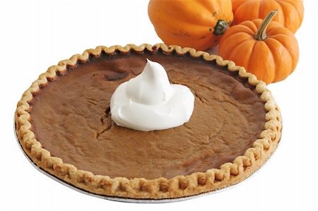 simsearch:649-05821475,k - A pumpkin pie with whipped cream and mini pumpkins in the background - isolated. Stockbilder - Microstock & Abonnement, Bildnummer: 400-03967077