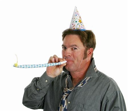 A happy guy at a new years eve party blowing a noisemaker and wearing a party hat. Stock Photo - Budget Royalty-Free & Subscription, Code: 400-03967071