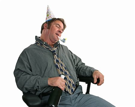 A man passed out in a chair after the office party. (horizontal view) Foto de stock - Super Valor sin royalties y Suscripción, Código: 400-03967084