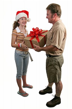 a girl in a Santa hat receiving a gift from a deliver man - Full view, isolated Stock Photo - Budget Royalty-Free & Subscription, Code: 400-03967080