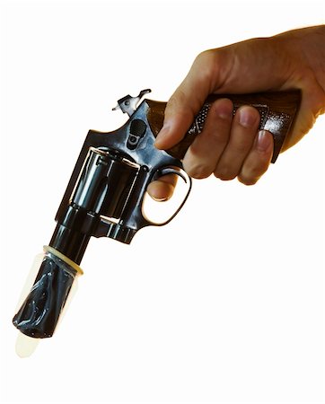 Cropped shot of a male hand holding a .38 calibre with a condom on it. Stock Photo - Budget Royalty-Free & Subscription, Code: 400-03967106