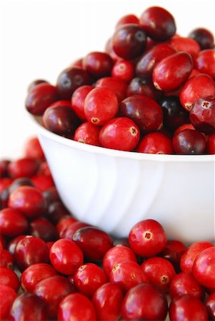 Fresh red cranberries in a bowl on white background Stock Photo - Budget Royalty-Free & Subscription, Code: 400-03967274