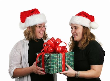 simsearch:400-07218254,k - Two girls exchanging Christmas gifts. Stock Photo - Budget Royalty-Free & Subscription, Code: 400-03967402