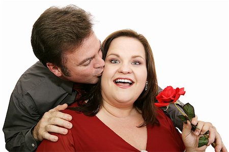 dress for fat women - Man surprises his date by giving her a rose and a kiss.  Isolated on white. Stock Photo - Budget Royalty-Free & Subscription, Code: 400-03967427