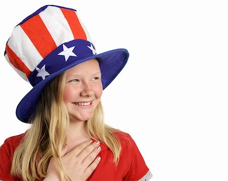 simsearch:600-07540311,k - A beautiful young girl dressed patriotically and saying the Pledge of Allegiance.  White background with room for text. Photographie de stock - Aubaine LD & Abonnement, Code: 400-03967421