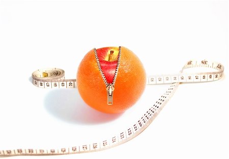 fun attractive concept for Healthy Eating with unzipped Orange and inner Apple Stock Photo - Budget Royalty-Free & Subscription, Code: 400-03967535