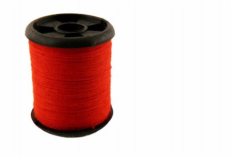 simsearch:649-06433365,k - Red spool of thread over white Photographie de stock - Aubaine LD & Abonnement, Code: 400-03967767