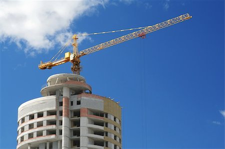crane with office buildings in the background Fotografie stock - Microstock e Abbonamento, Codice: 400-03968115