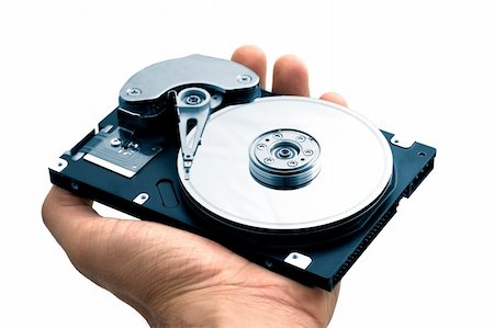 Hand with a open hard disk drive Photographie de stock - Aubaine LD & Abonnement, Code: 400-03968293