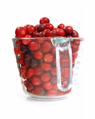 Fresh red cranberries in a glass measuring cup on white background Stock Photo - Budget Royalty-Free & Subscription, Code: 400-03968744