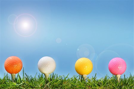 Colored golf balls in the grass Stock Photo - Budget Royalty-Free & Subscription, Code: 400-03968887