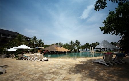 simsearch:400-05215524,k - Swimming pool to cool off in on that perfect summer holiday. Hotel Kartika. Bali Foto de stock - Super Valor sin royalties y Suscripción, Código: 400-03969054