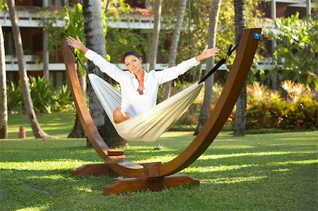 simsearch:400-03969202,k - 20-25 years woman portrait ralaxing on hammock at exotic surrounding, bali indonesia Foto de stock - Royalty-Free Super Valor e Assinatura, Número: 400-03969091