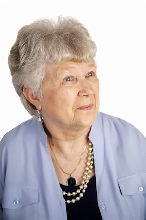 simsearch:400-05020346,k - A pretty senior woman looking of with an expression of contentment.  White background Stock Photo - Budget Royalty-Free & Subscription, Code: 400-03969136
