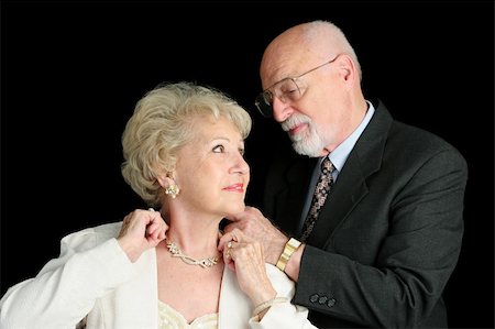 elderly person getting dressed - A horizontal view of a senior man fastening his wife's necklace as they prepar for an evening out. Stock Photo - Budget Royalty-Free & Subscription, Code: 400-03969181