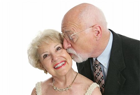 simsearch:400-05340916,k - A pretty senior woman giggling as her husband surprises her with a kiss. Foto de stock - Super Valor sin royalties y Suscripción, Código: 400-03969244