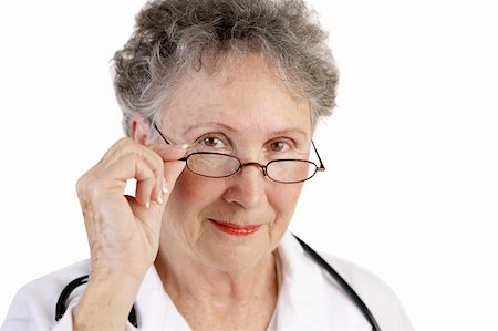 simsearch:400-04552598,k - A trustworthy, mature female doctor.  Closeup over white background. Foto de stock - Super Valor sin royalties y Suscripción, Código: 400-03969252