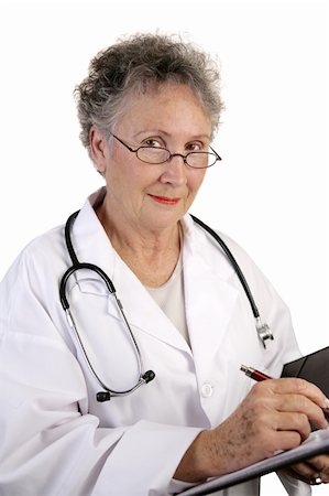 simsearch:400-04217553,k - A mature female doctor writing in a chart.  Closeup view on white. Foto de stock - Royalty-Free Super Valor e Assinatura, Número: 400-03969253