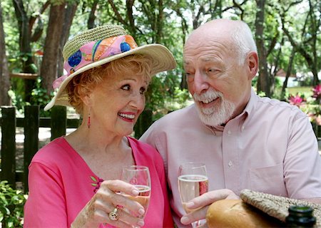 An attractive senior couple on a picnic toasting with champagne. Stock Photo - Budget Royalty-Free & Subscription, Code: 400-03969267
