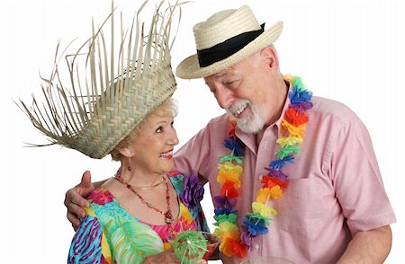 senior couple retirement - An attractive senior couple on a tropical vacation. Isolated. Photographie de stock - Aubaine LD & Abonnement, Code: 400-03969332
