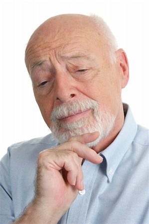 An intelligent senior man thinking over a problem. Stock Photo - Budget Royalty-Free & Subscription, Code: 400-03969369