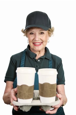 A pretty senior lady working at a coffee shop.  Isolated on white. Stock Photo - Budget Royalty-Free & Subscription, Code: 400-03969382