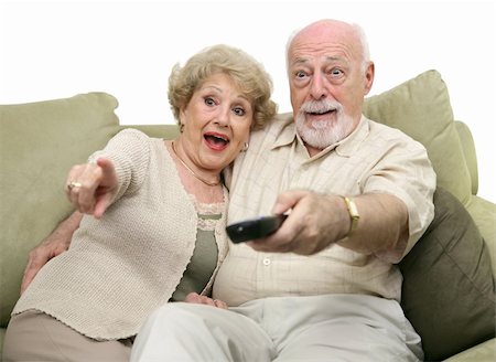 simsearch:400-05195435,k - A senior couple really enjoying a television program.  White background. Stockbilder - Microstock & Abonnement, Bildnummer: 400-03969414