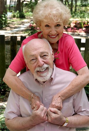 simsearch:400-05711437,k - A happy senior couple embracing outdoors.  They are still in love after many years together. Stock Photo - Budget Royalty-Free & Subscription, Code: 400-03969429