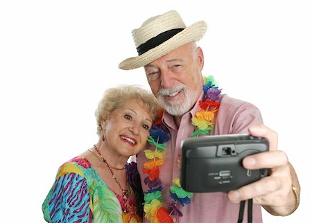 simsearch:862-03808758,k - An attractive senior couple taking their picture on vacation. Photographie de stock - Aubaine LD & Abonnement, Code: 400-03969464