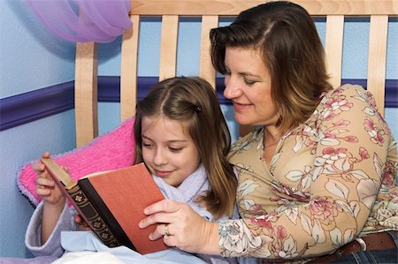 a mother and daughter reading bedtime stories together Stock Photo - Budget Royalty-Free & Subscription, Code: 400-03969711