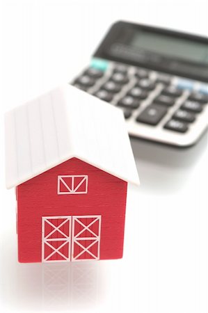 The red house and the calculator on a white background Stockbilder - Microstock & Abonnement, Bildnummer: 400-03969769