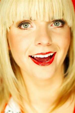 simsearch:614-00684036,k - Portrait of beautiful young smiling woman with red lipstick Stockbilder - Microstock & Abonnement, Bildnummer: 400-03960201