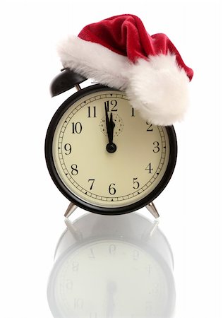 simsearch:614-03903058,k - Black alarm clock in a New Year's cap on a white background Foto de stock - Royalty-Free Super Valor e Assinatura, Número: 400-03960285