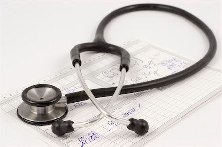 simsearch:400-07976201,k - Stethoscope lying on a medical report on a white desk Stock Photo - Budget Royalty-Free & Subscription, Code: 400-03960421