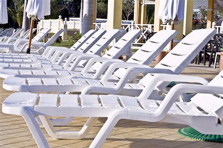 simsearch:862-08273009,k - Caribbean holidays pool chairs Photographie de stock - Aubaine LD & Abonnement, Code: 400-03960558