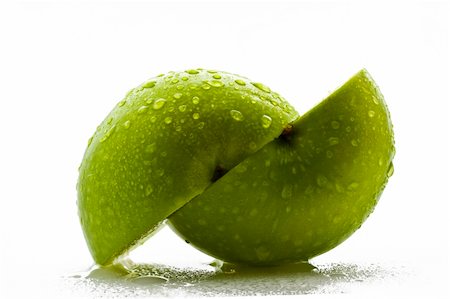 Two green apple halfs over white background Photographie de stock - Aubaine LD & Abonnement, Code: 400-03961044