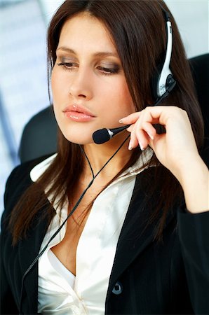 simsearch:400-03914864,k - Beautiful young woman working as Call Center operator Stock Photo - Budget Royalty-Free & Subscription, Code: 400-03961463