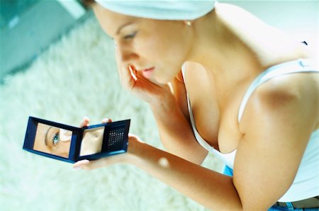 Pretty young brunette girl doing morning makeup. Stock Photo - Budget Royalty-Free & Subscription, Code: 400-03962738