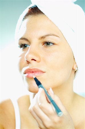 Pretty young brunette girl doing morning makeup. Stock Photo - Budget Royalty-Free & Subscription, Code: 400-03962733