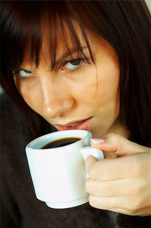 Brunette business woman with white cup of black coffee Stock Photo - Budget Royalty-Free & Subscription, Code: 400-03962755