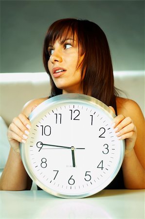 Brunette young woman with classic clock Photographie de stock - Aubaine LD & Abonnement, Code: 400-03962774